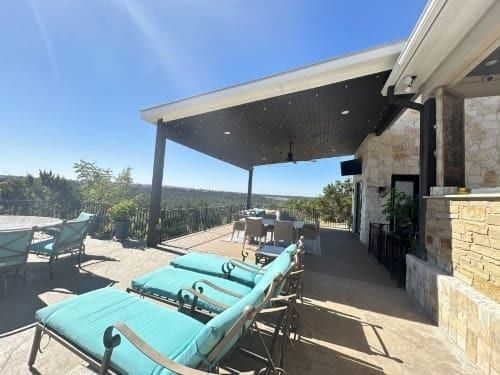 A patio with blue chairs for relaxation