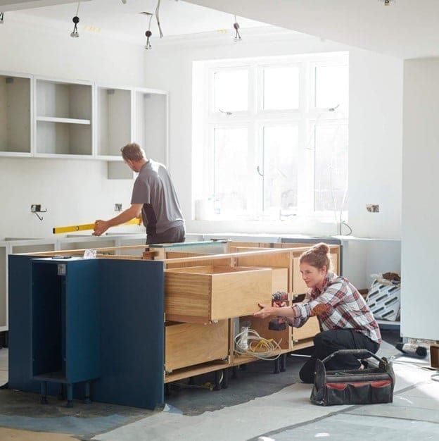 Kitchen renovation in progress with cabinet installation in a home in Austin, TX