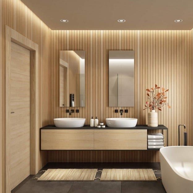 Modern bathroom with double sinks and wood paneling in Austin, TX