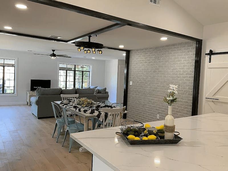 Open-concept kitchen and living area after home remodel in Austin, TX