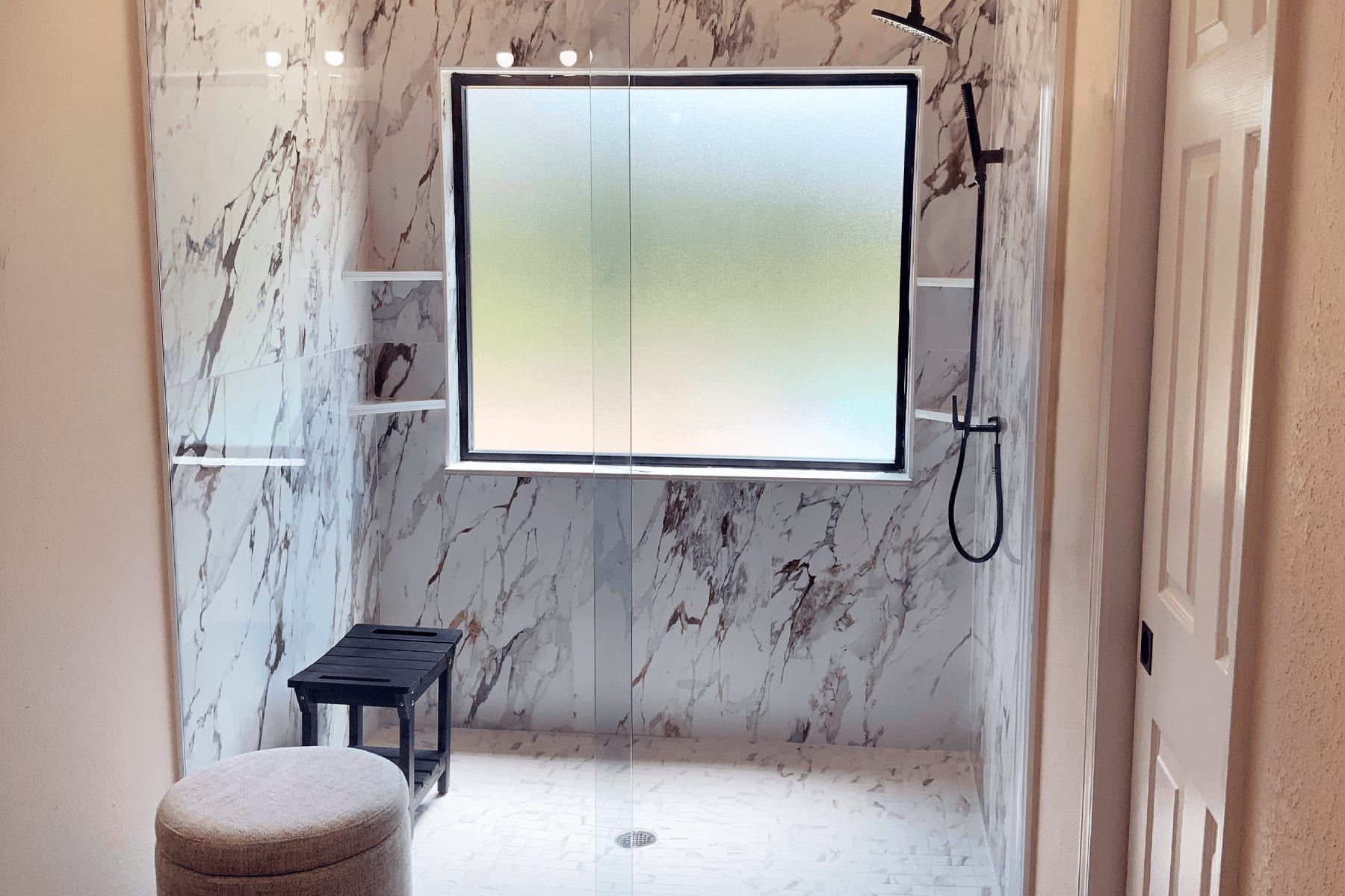 Aging-in-place bathroom remodel in Leander with a curbless marble-look shower