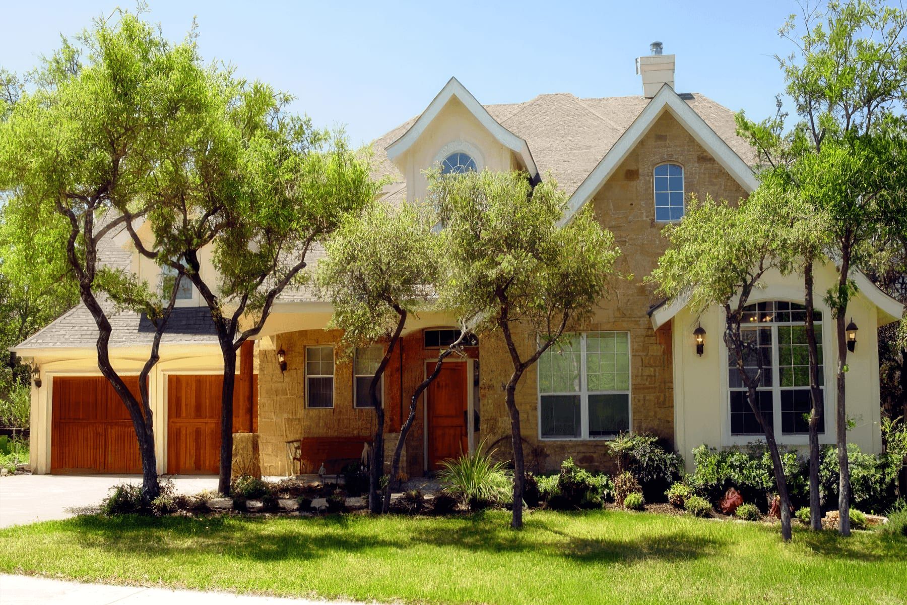 Stone exterior and gabled roofline of a custom home in Georgetown