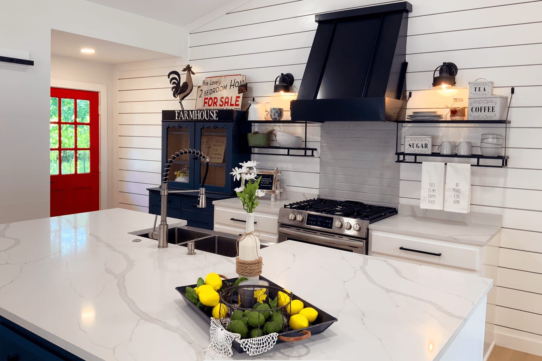 Full kitchen remodel in Taylor with white cabinetry, granite counters, and stainless appliances