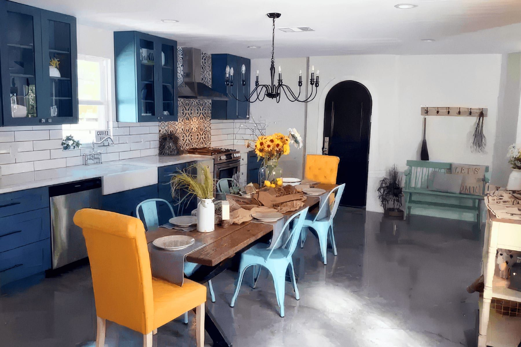 Open-concept kitchen and dining area in Taylor with navy cabinetry, a farmhouse sink, and a long dining table