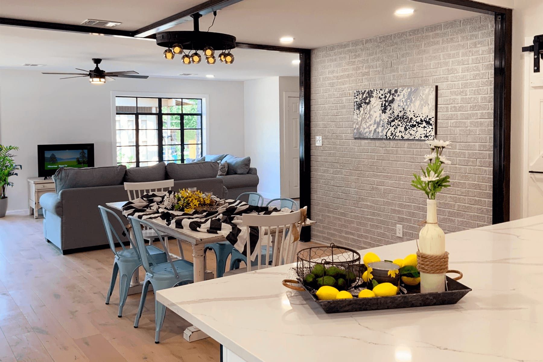 Open living and dining area after the remodel, seen from the kitchen island