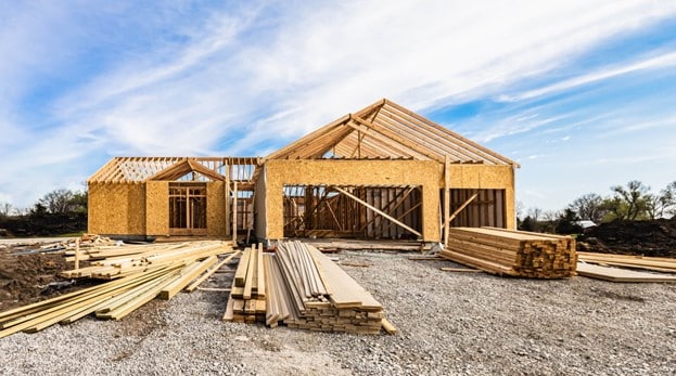 A house under construction with wood beams