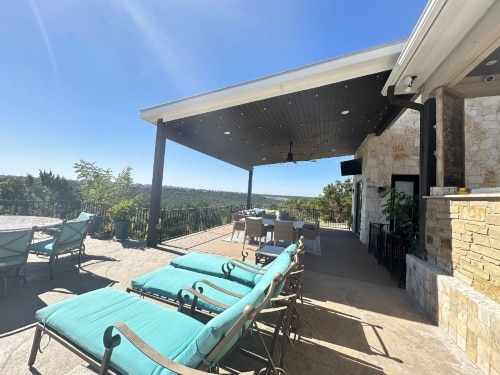 A patio with blue chairs for relaxation in Liberty Hills, TX<br />
